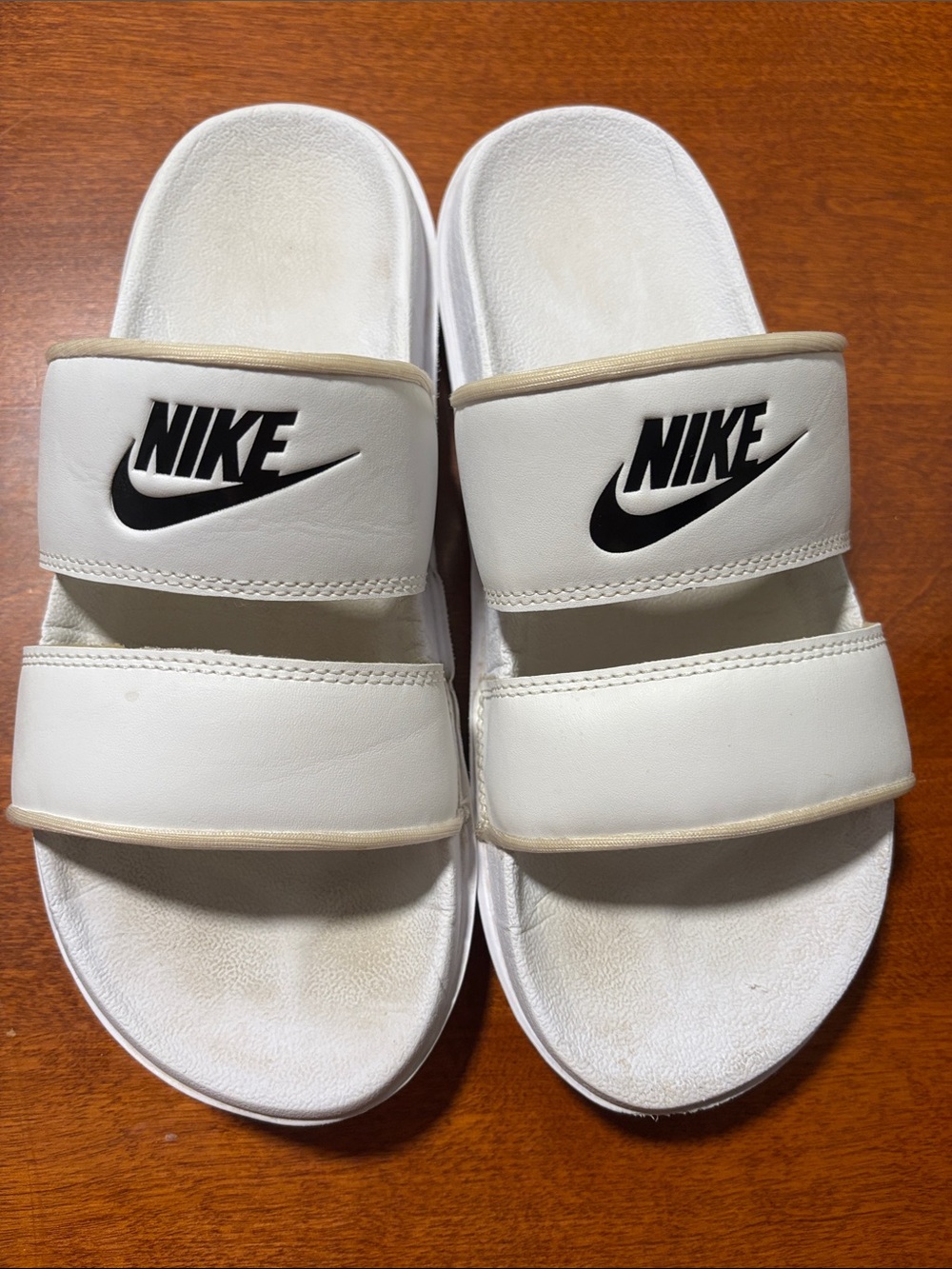 Nike White Slide Sandals with Black Swoosh